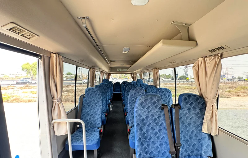 Interior — 26 reclining cloth seats with belts